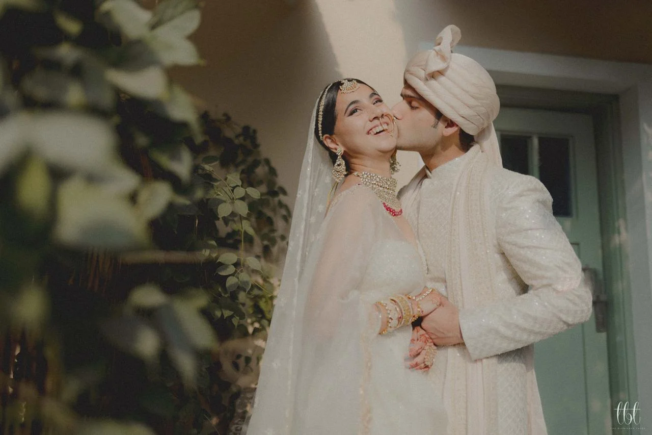 Bride and groom sharing an intimate wedding portrait