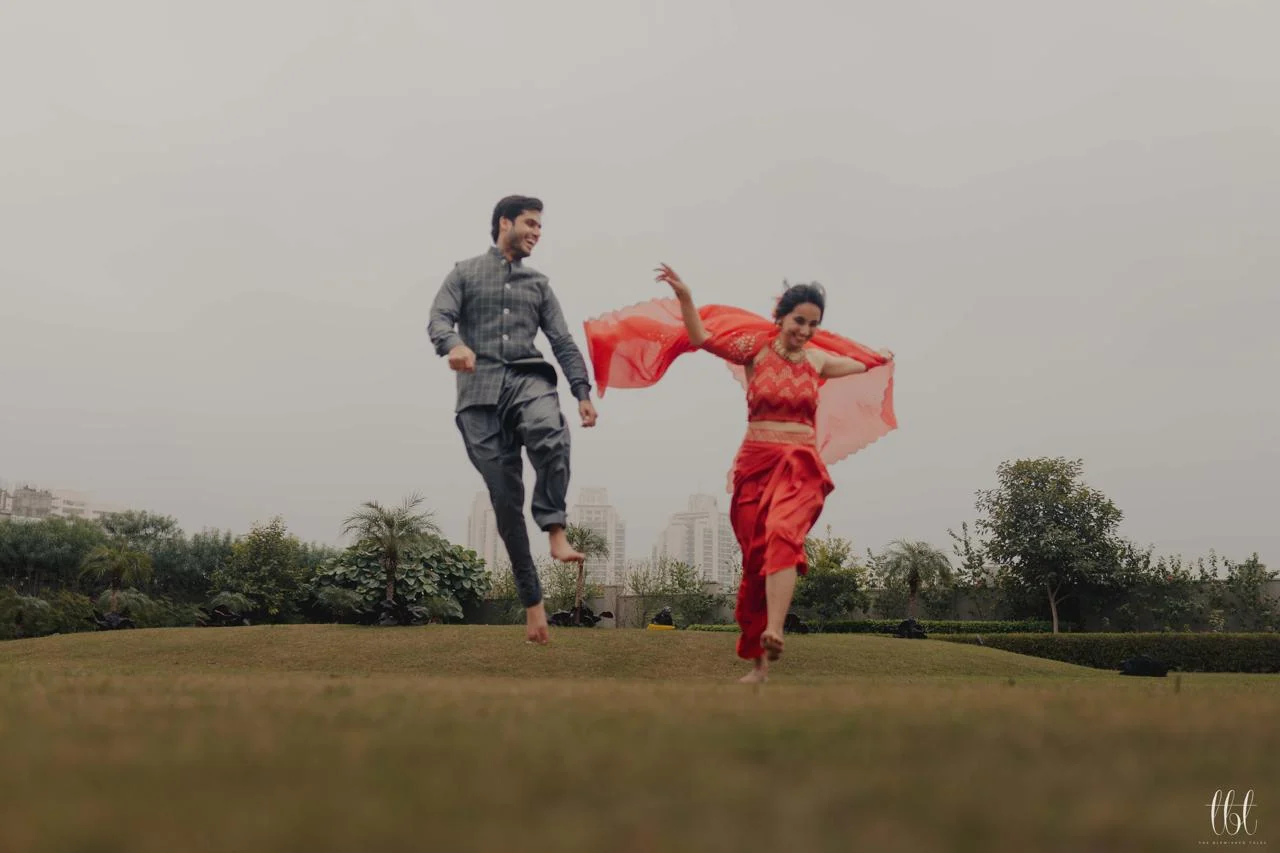 Couple running together during a candid outdoor shoot